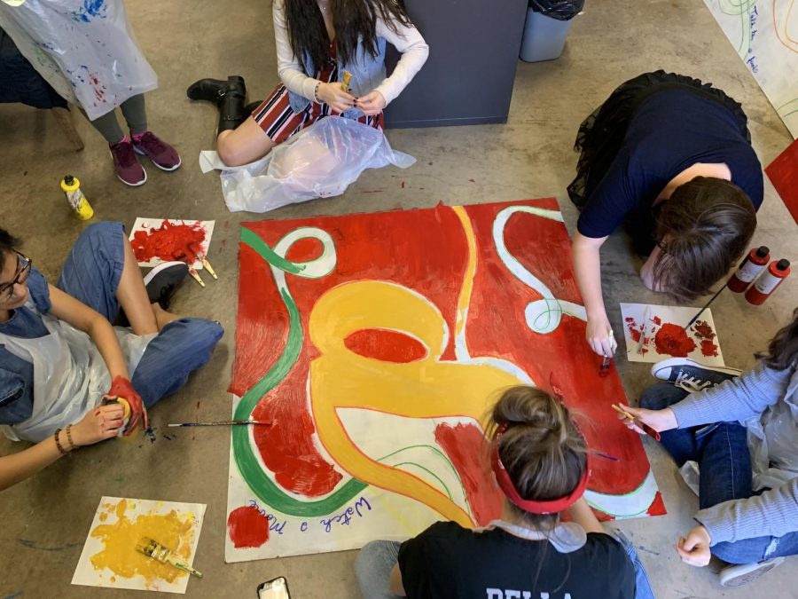 Members of the Student Wellness Advisory Group (Seniors Meher Muzaffar, Casey Miller, Danielle Serrao, Bella DePaola, Caroline Waters and Julia Friedhoff) work on a mural to be hung in the new student lounge area in the 800s hallway.