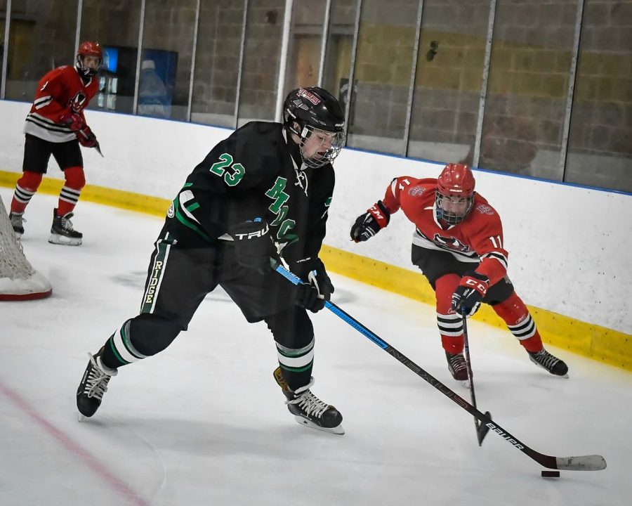 Hunterdon Centrals Darin Michaels (11) battle for control of the puck during the game at Flemington Ice Arena in Flemington, NJ on 12-14-2019.