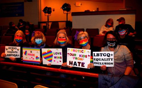 Community members present at the Board of Education meeting on February, 28th. They are adorned in rainbow masks that were handed out outside of the Little Theater prior to the meeting, and holding signs advocating for inclusion and acceptance at Hunterdon Central.