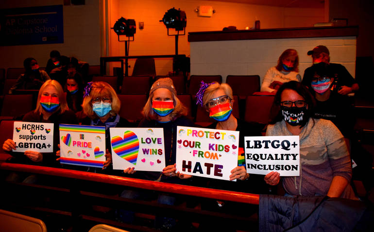 Community+members+present+at+the+Board+of+Education+meeting+on+February%2C+28th.+They+are+adorned+in+rainbow+masks+that+were+handed+out+outside+of+the+Little+Theater+prior+to+the+meeting%2C+and+holding+signs+advocating+for+inclusion+and+acceptance+at+Hunterdon+Central.