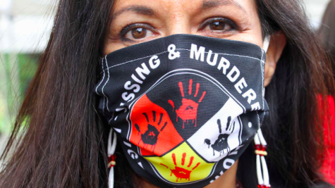 A woman wears this face mask to protest amidst the the Missing and Murdered Indigenous Womens Crisis. 