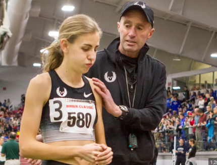 Young Mary Cain with her former coach Alberto Salazar before setting the junior world record.
