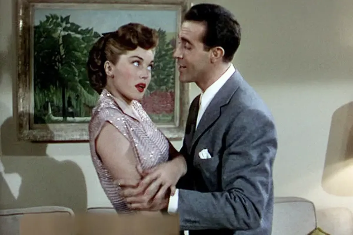 The scene from Neptune’s Daughter, featuring Esther Williams and Ricardo Montalban, as both actors sing the lyrics of the now infamous holiday song.
