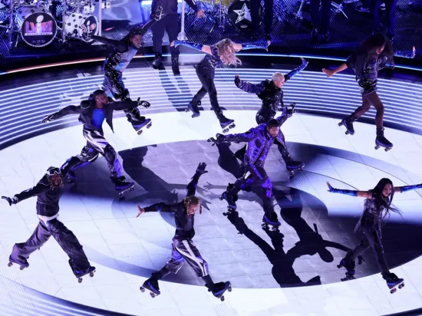 Usher performing on roller skates, along with his backup dancers at the Super Bowl Halftime show 2024